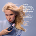 Woman with blonde hair holding a UNOVA hair oil bottle against a blue background