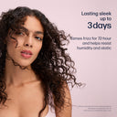 Woman with curly hair against a pink background with text about hair product benefits