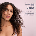 Woman with curly hair against a pink background with text about hair product benefits